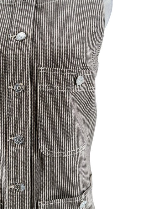 Close-up of a black and white striped jacket with button details on a white background