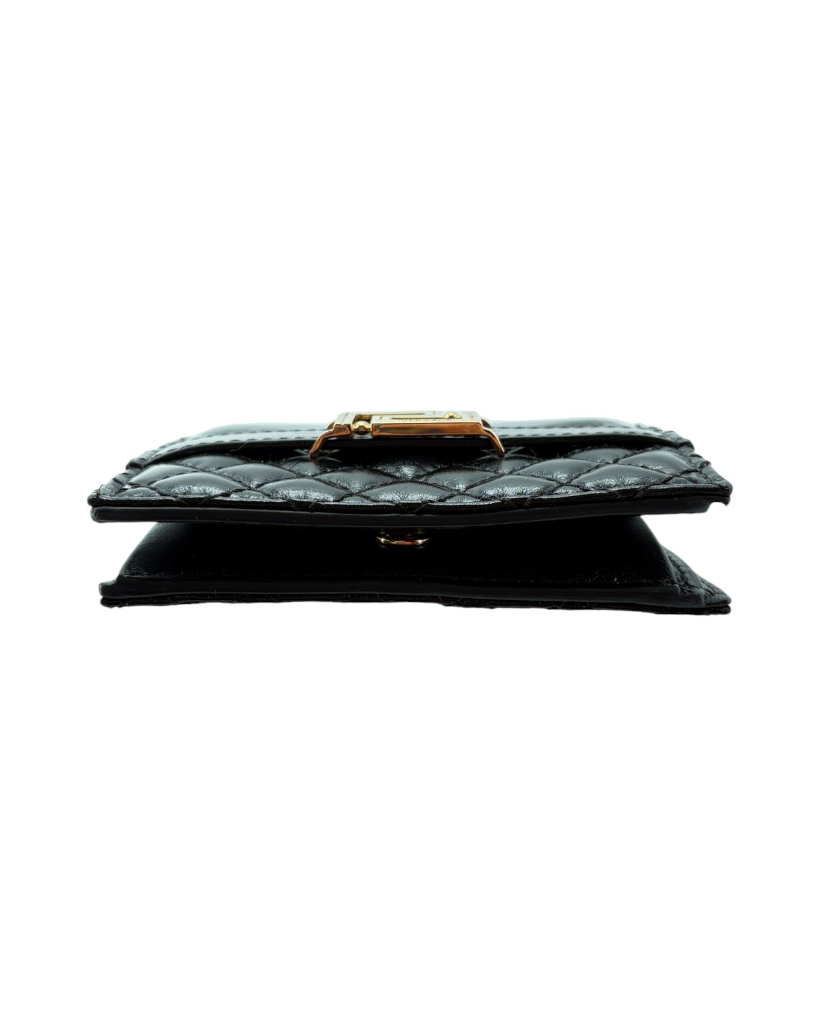 Black quilted wallet with gold clasp on a white background