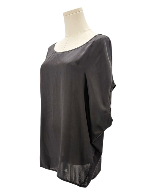 Black sheer top on a mannequin against a white background