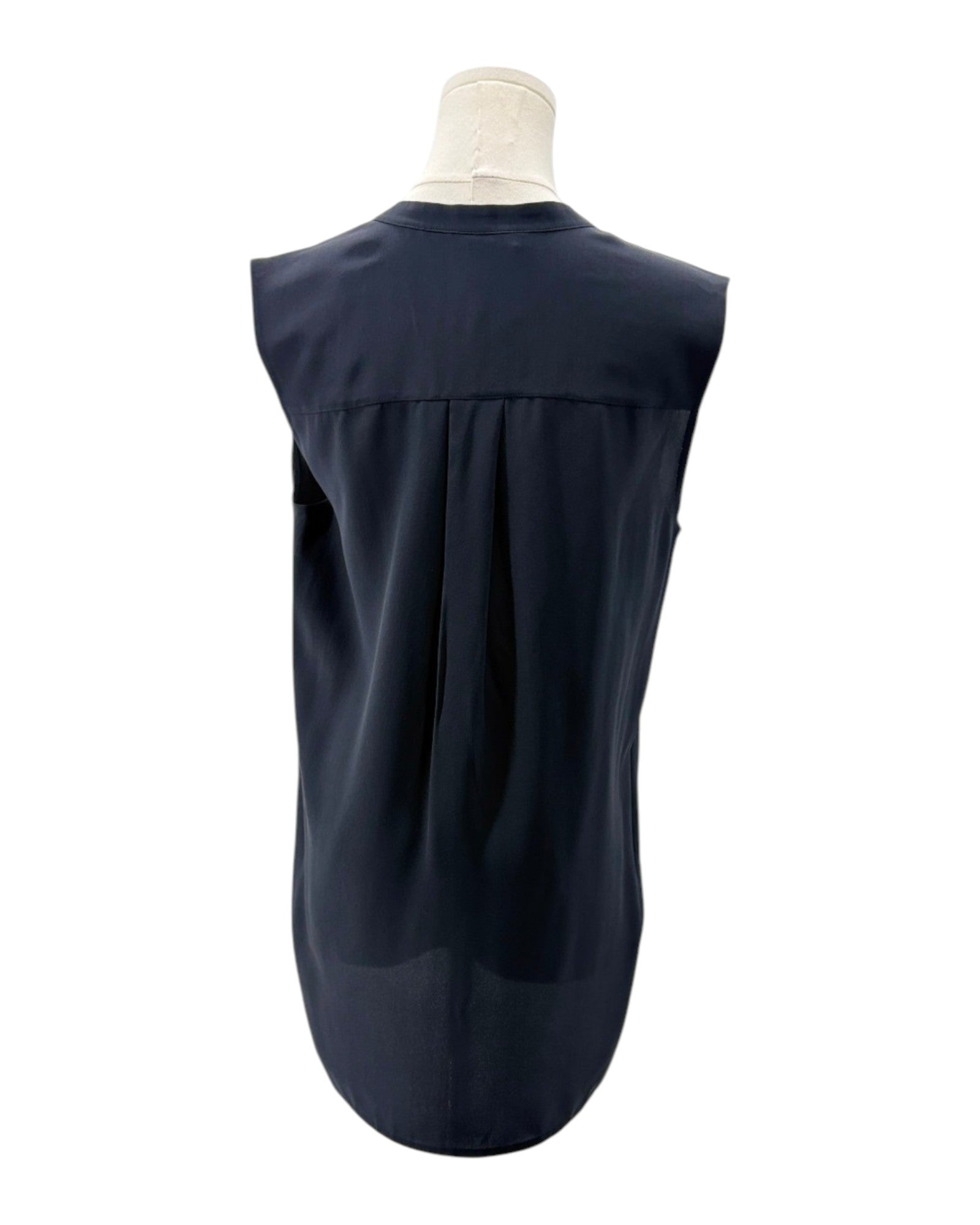 Navy sleeveless top on a mannequin against a white background