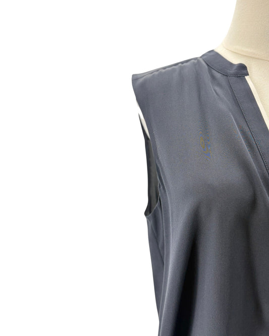 navy sleeveless top on a mannequin against a white background