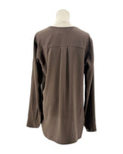Brown shirt on a mannequin against a white background