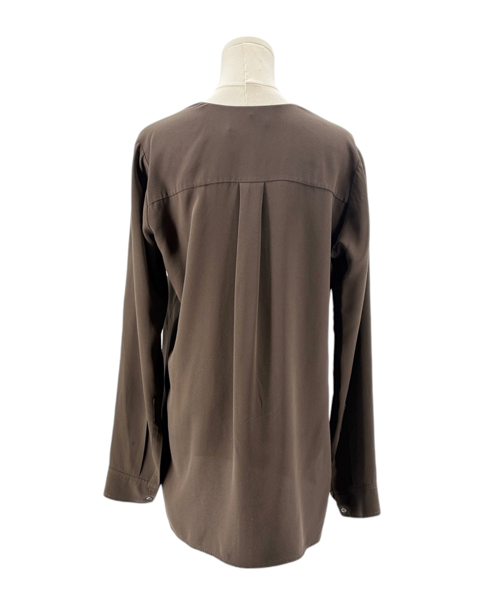 Brown shirt on a mannequin against a white background