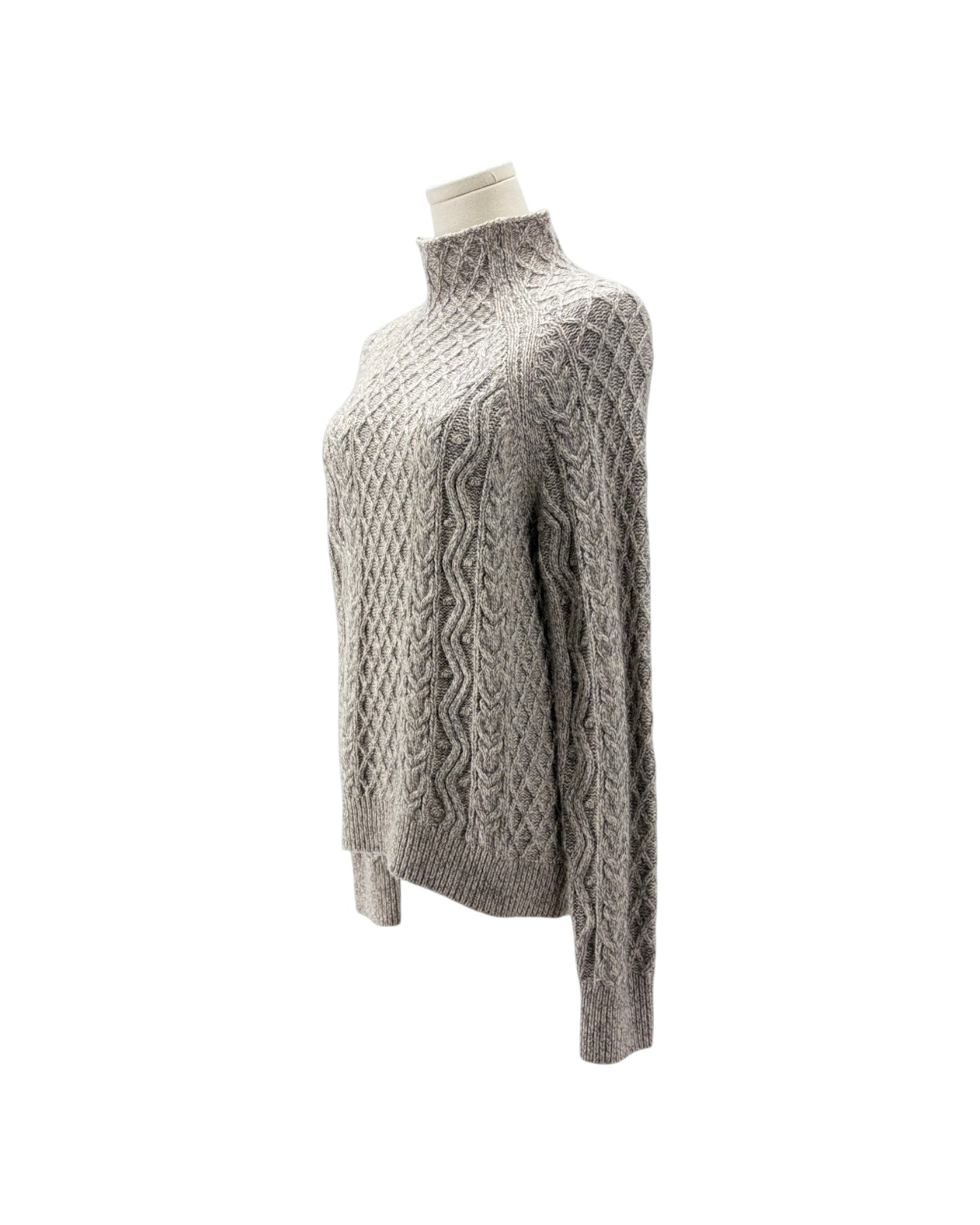 A light gray cable-knit mock neck sweater displayed on a cream mannequin torso against a plain white background.