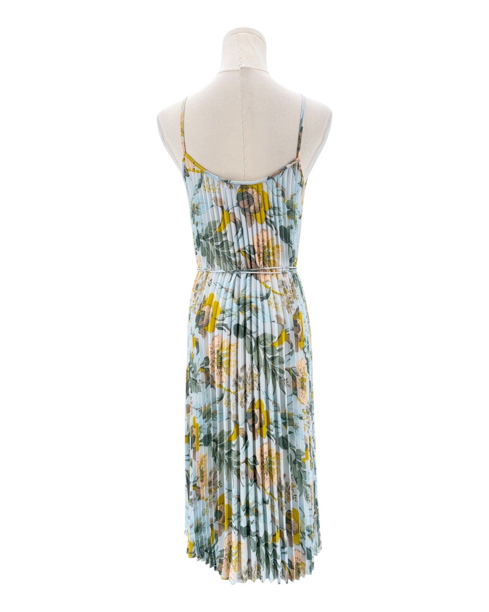 Floral dress on a mannequin against a white background