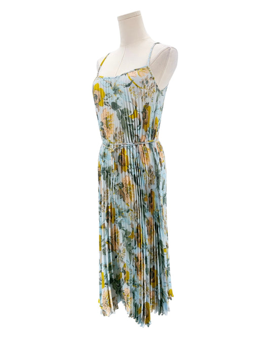 Floral dress on a mannequin against a white background