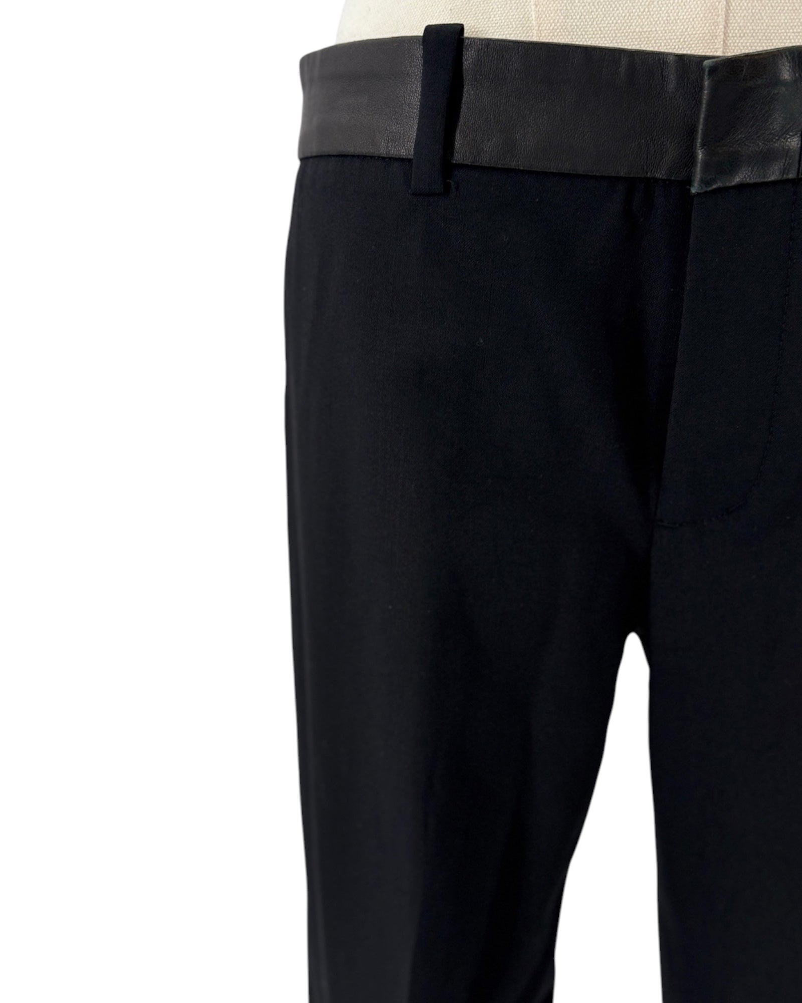 Black pants with a leather waistband on a white background