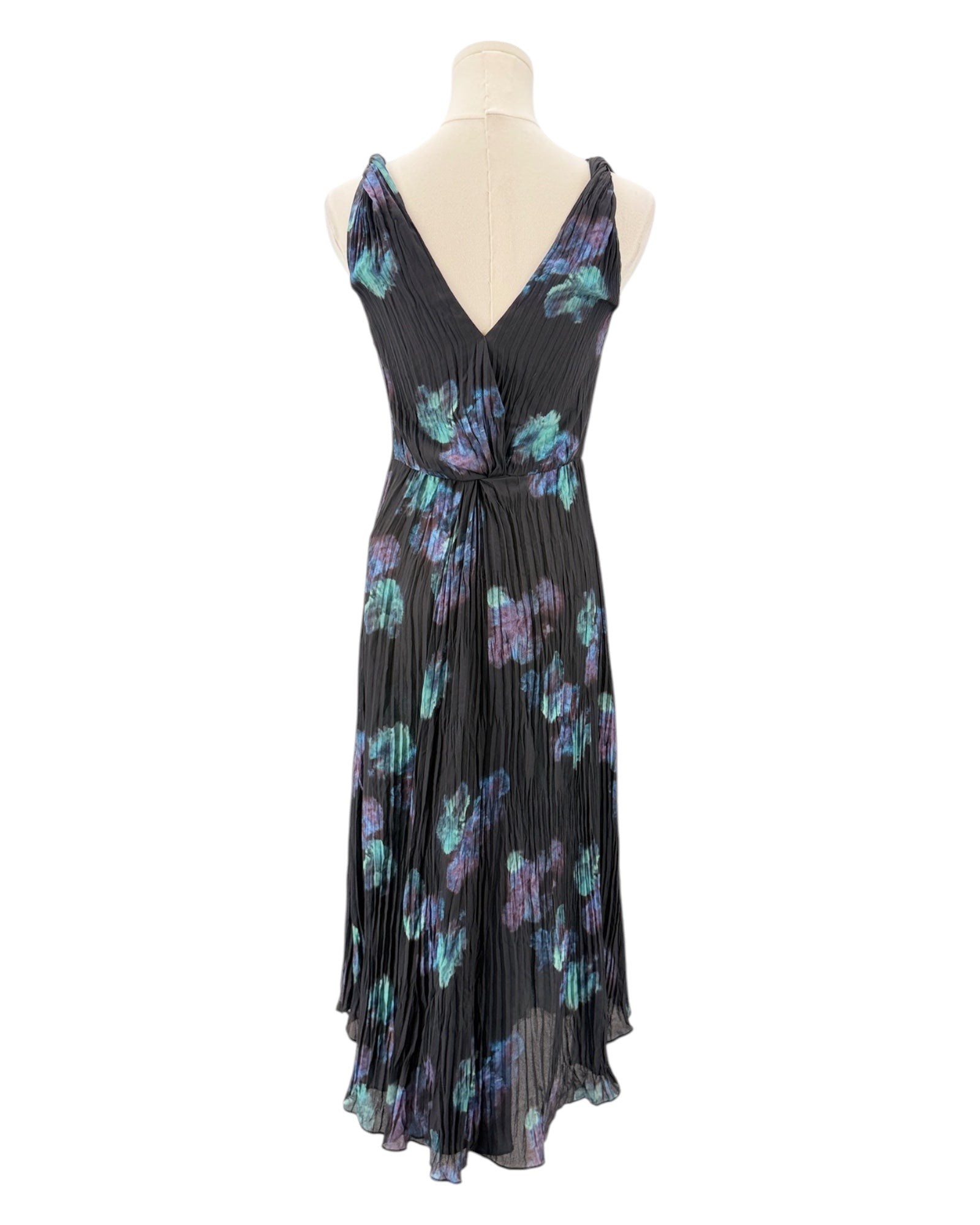 Black dress with colorful floral pattern on a mannequin against a white background