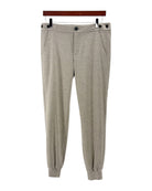 Gray wool jogger pants on a white background