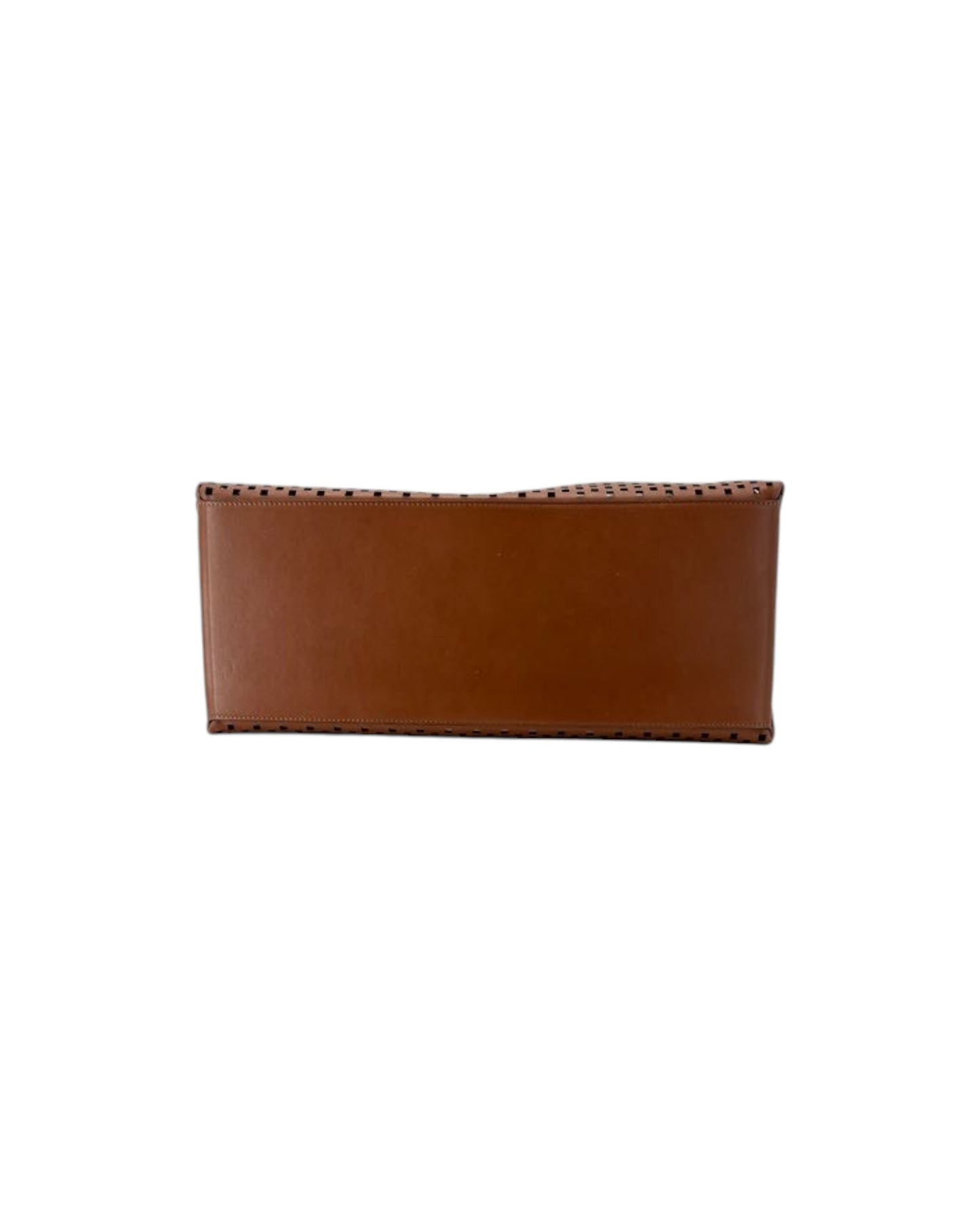 A brown leather tote bag with an all-over perforated dot pattern, shown against a plain white background.
