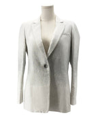 White blazer on a mannequin against a white background