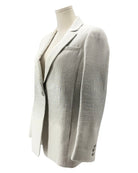 Light gray blazer on a mannequin against a white background