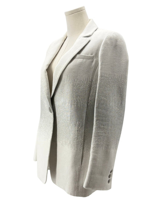 Light gray blazer on a mannequin against a white background