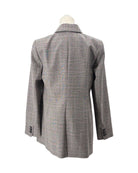 Gray checkered coat on a mannequin against a white background