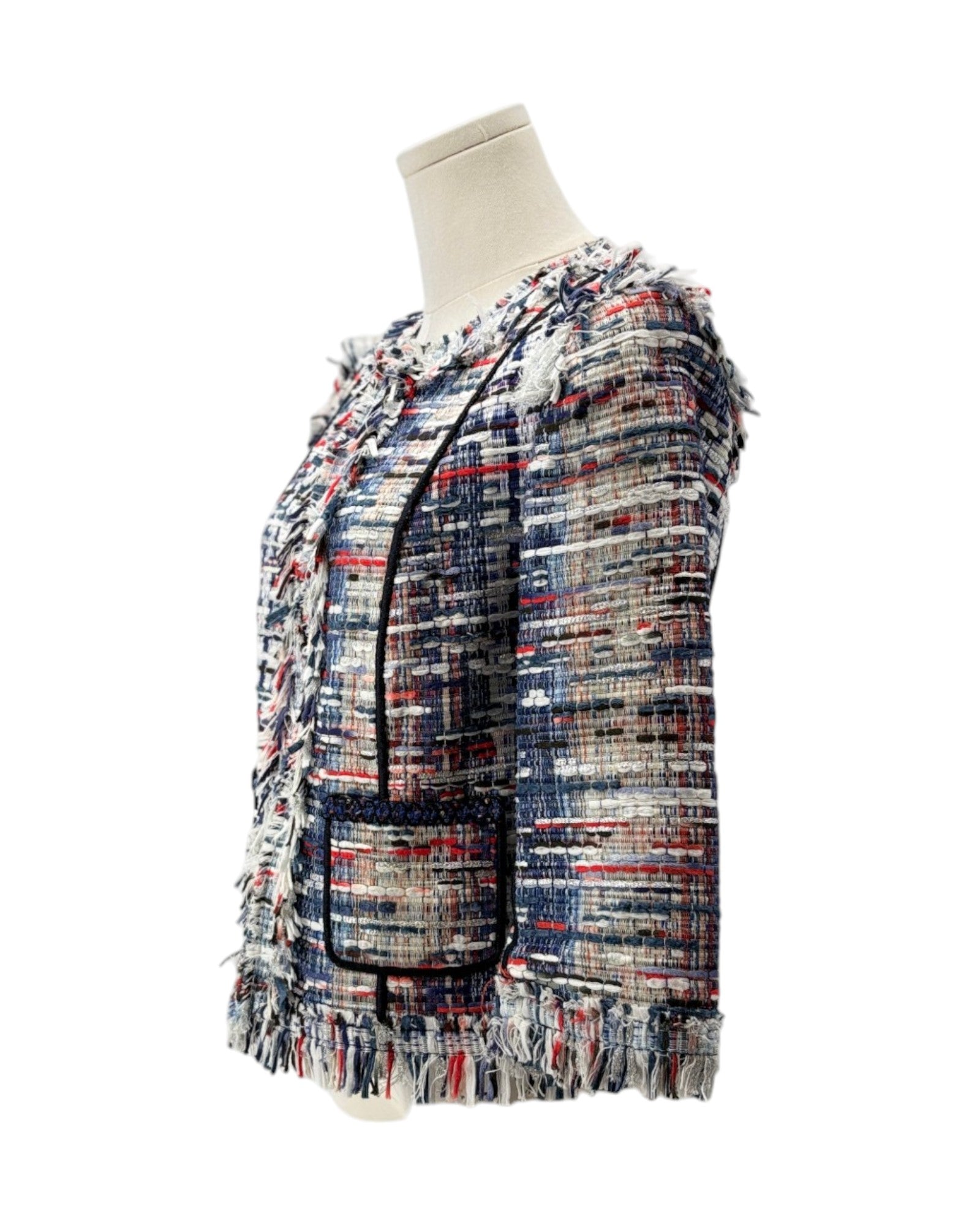 Multicolored textured jacket on a mannequin against a white background