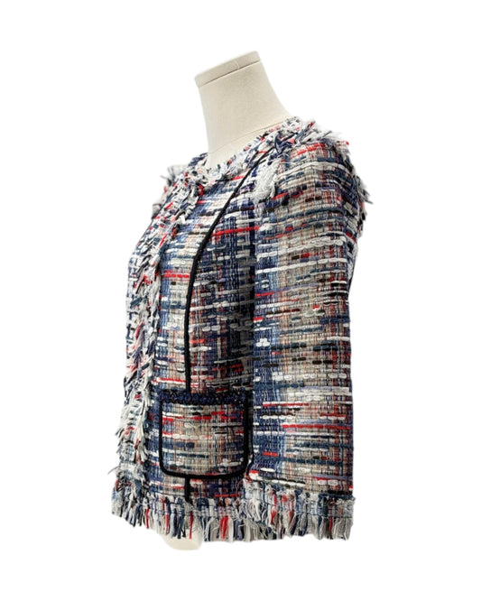 Multicolored textured jacket on a mannequin against a white background