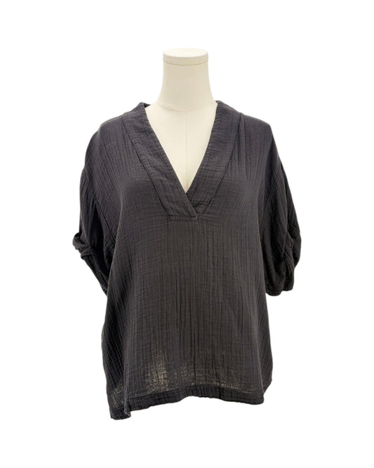 black textured top on a mannequin against a white background