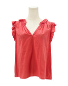 Coral sleeveless top with ruffled shoulders on a mannequin against a white background