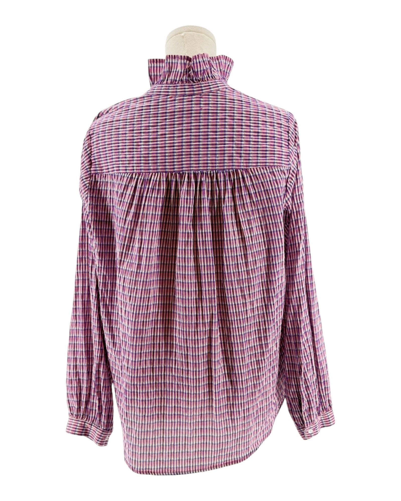 Pink and white checkered blouse on a mannequin against a white background