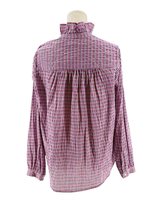 Pink and white checkered blouse on a mannequin against a white background