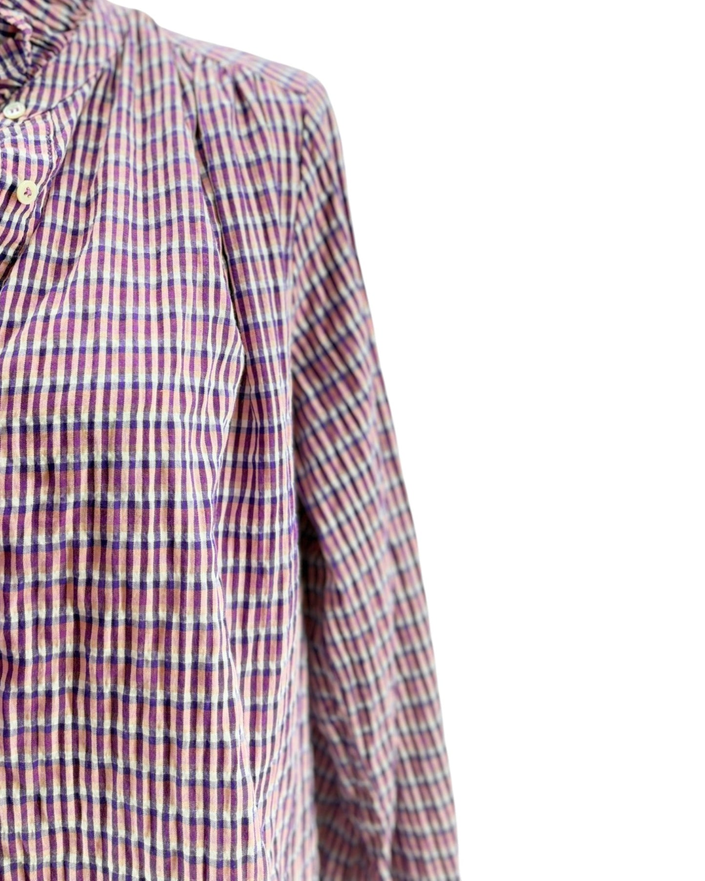 Close-up of a checkered shirt with a white background