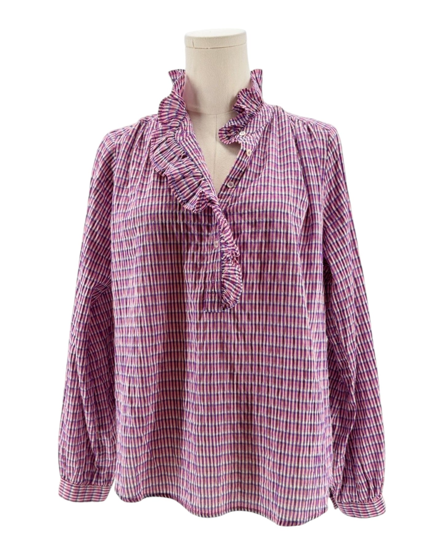 Pink and white checkered blouse on a mannequin against a white background
