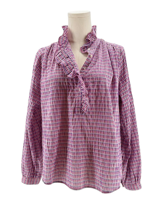Pink and white checkered blouse on a mannequin against a white background