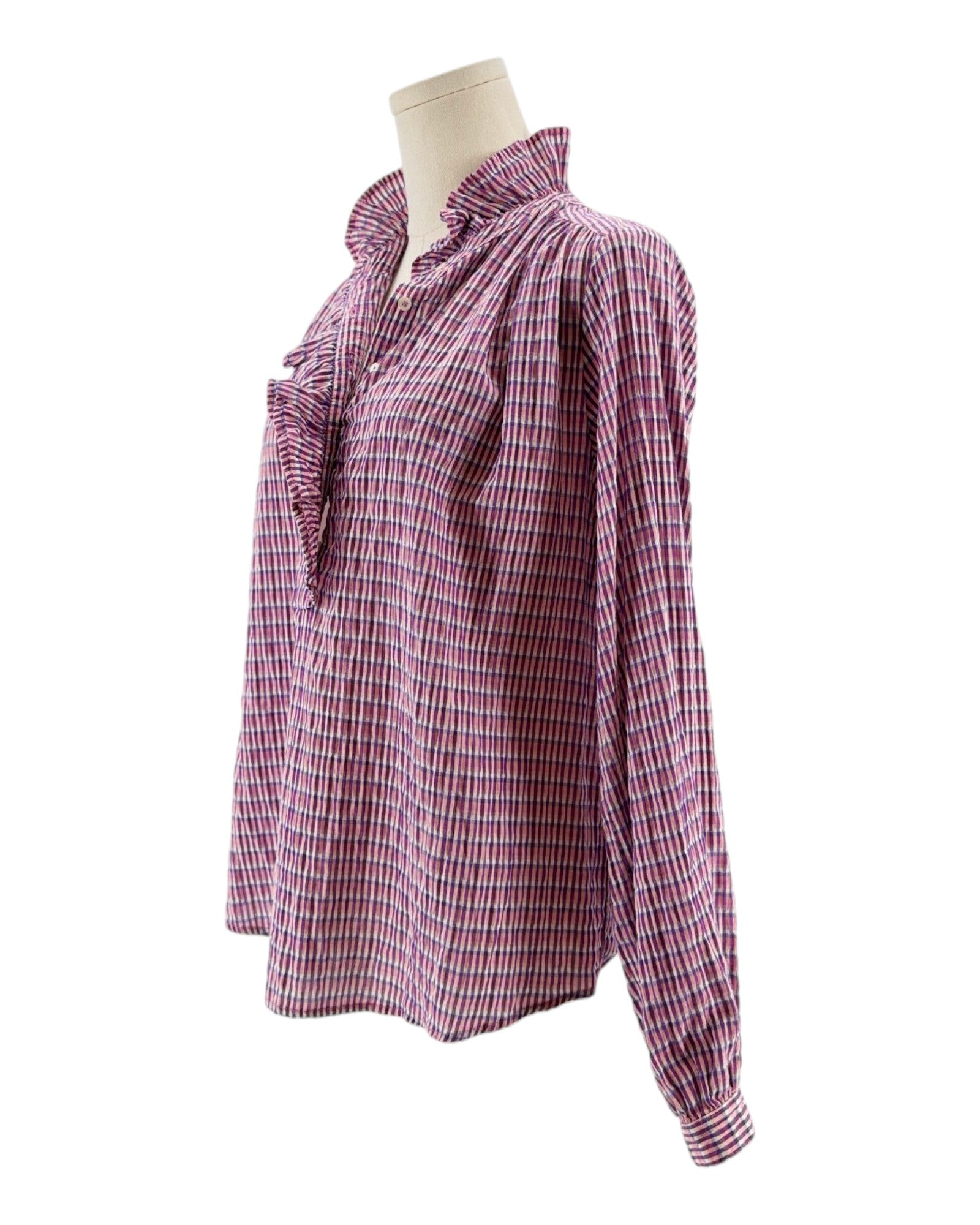 Pink and white checkered blouse on a mannequin against a white background
