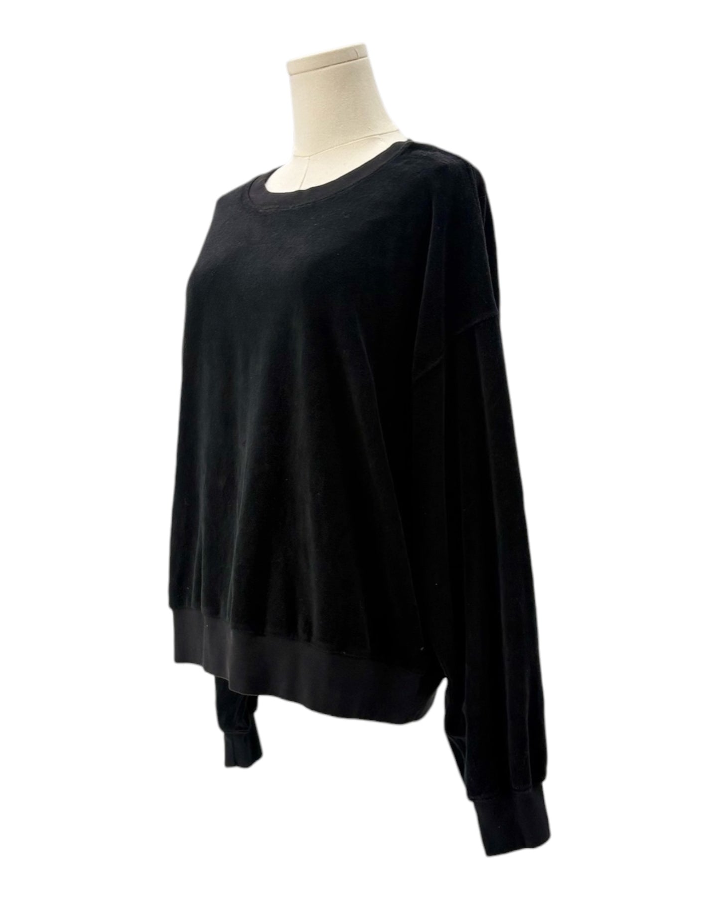 Black sweatshirt on a mannequin against a white background