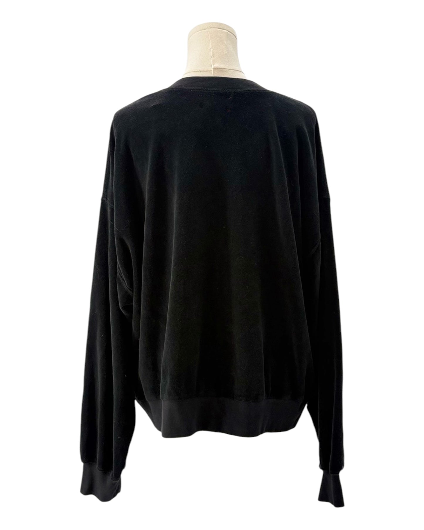 Black sweatshirt on a mannequin against a white background