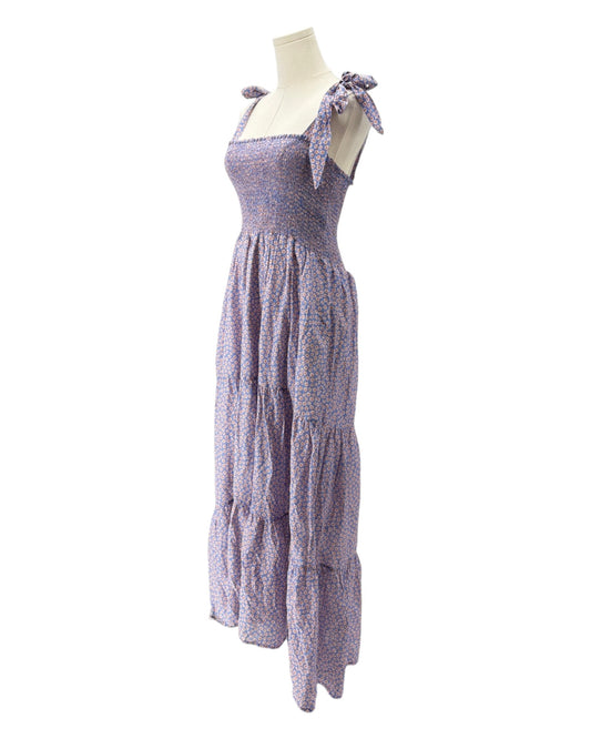 Purple dress on a mannequin against a white background