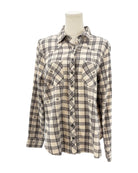 Plaid shirt on a mannequin against a white background