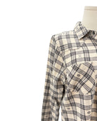 Plaid shirt on a mannequin against a white background
