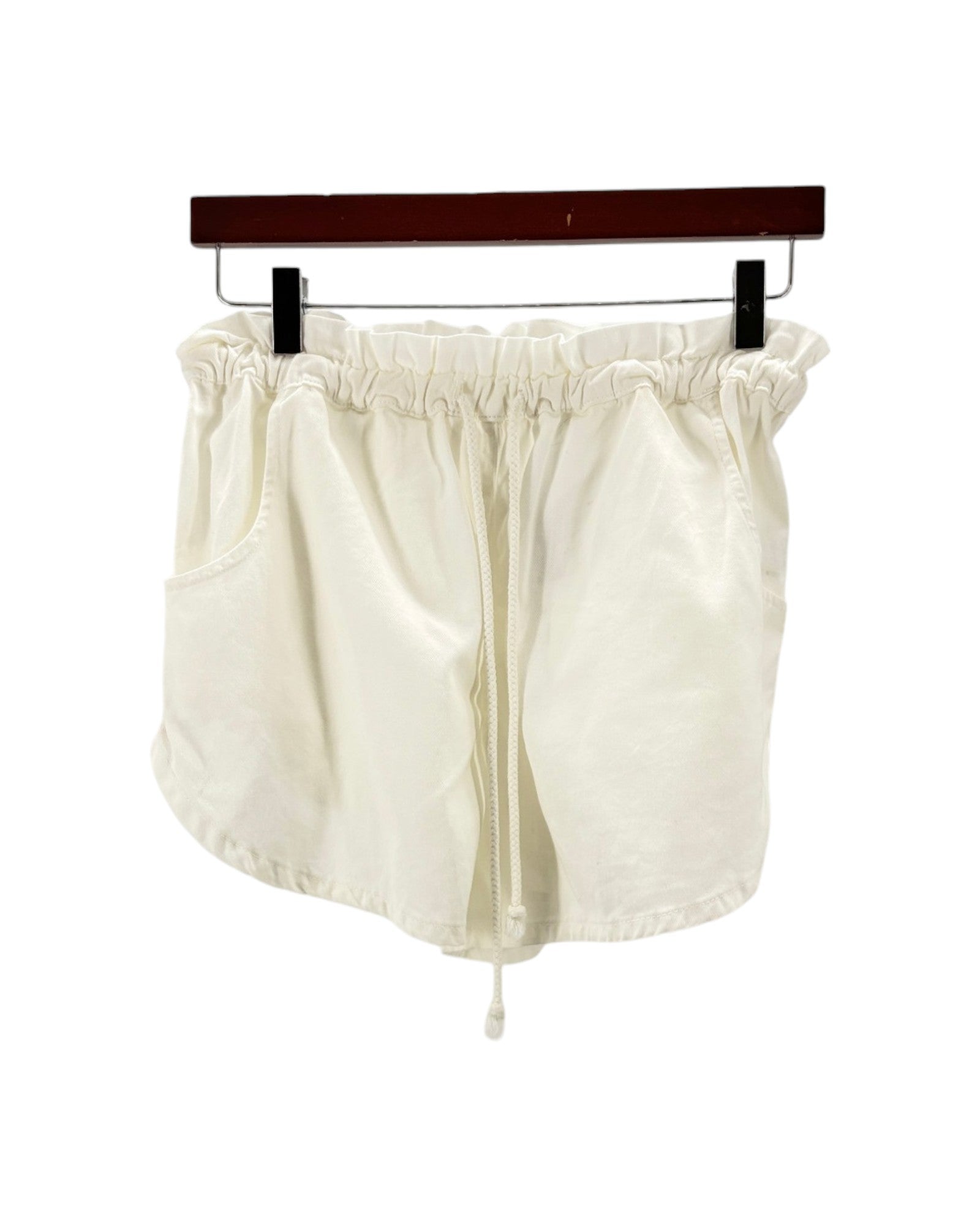 White shorts on a hanger against a white background