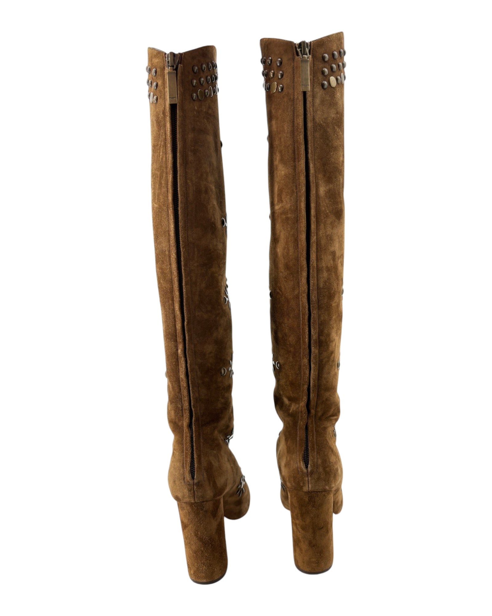 Pair of brown suede knee-high boots with decorative zippers on a white background