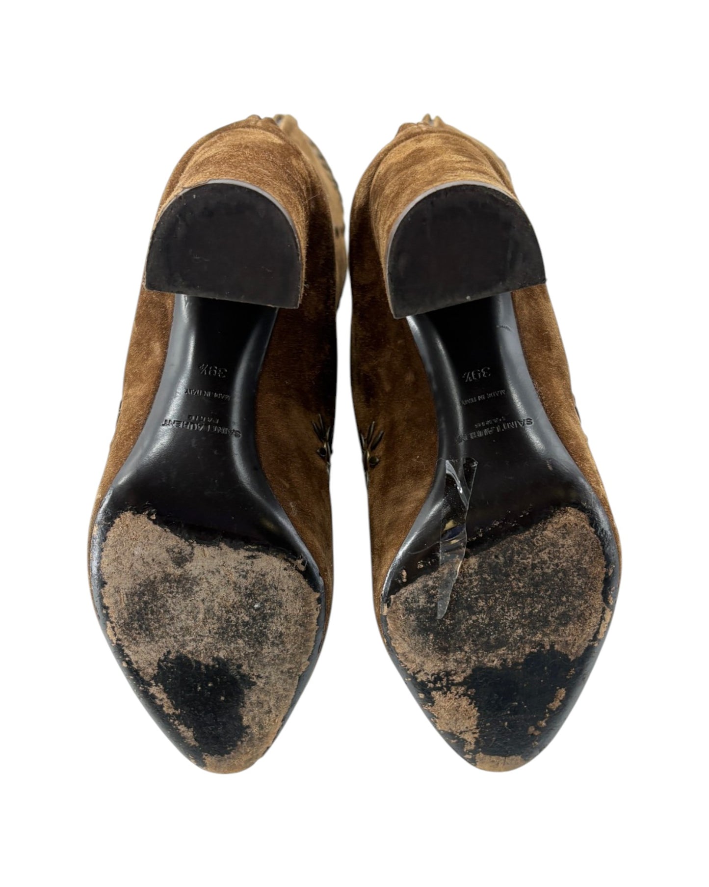 Pair of brown suede shoes with black soles on a white background