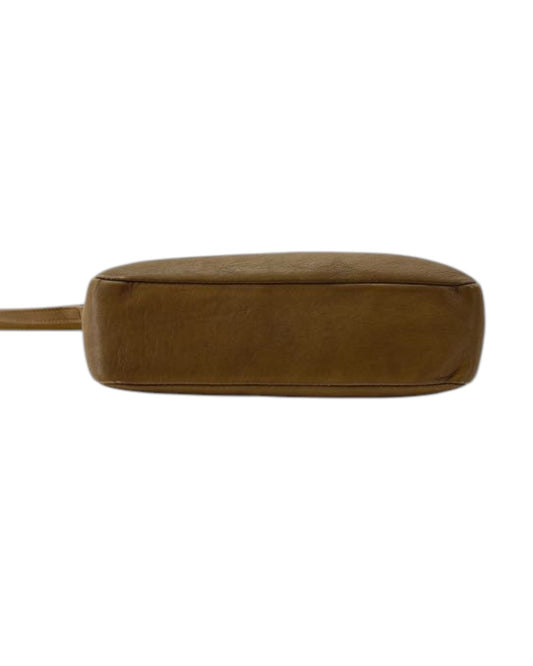 Brown leather bag strap on a white background