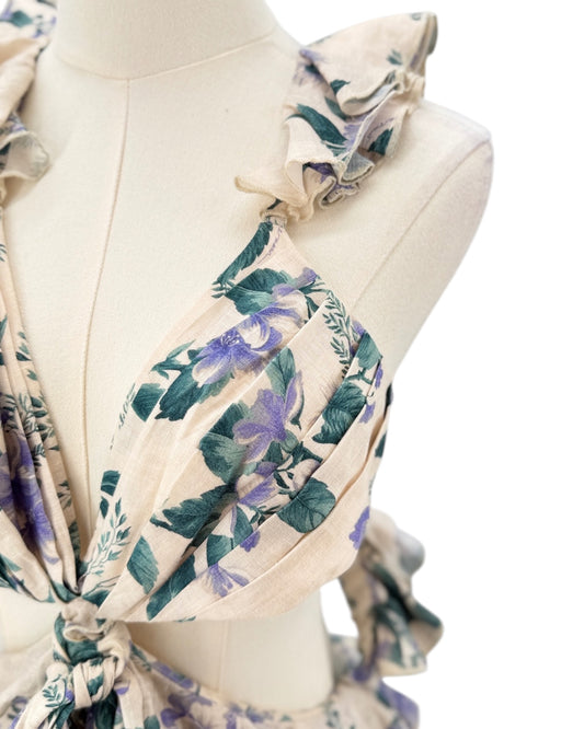 Floral patterned scarf on a mannequin with a white background