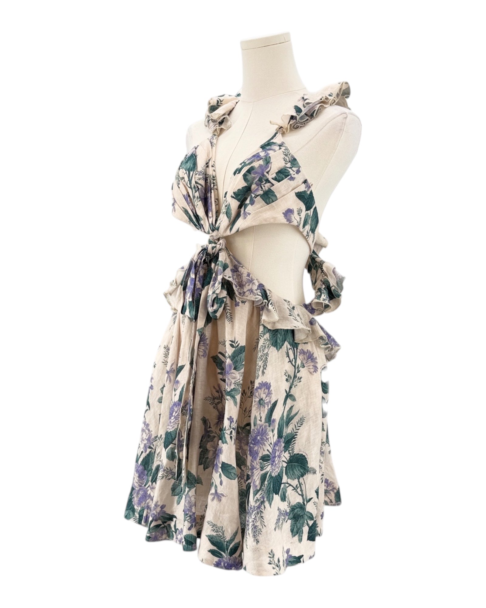 Floral dress on a mannequin against a white background