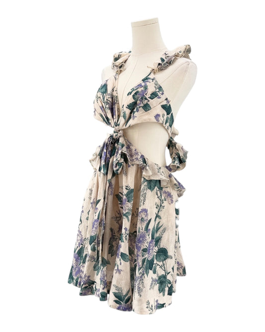 Floral dress on a mannequin against a white background