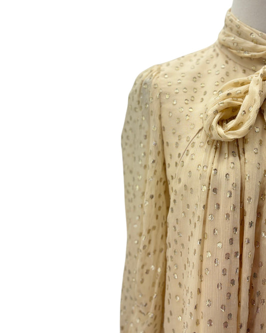 Beige blouse with a pattern on a white background