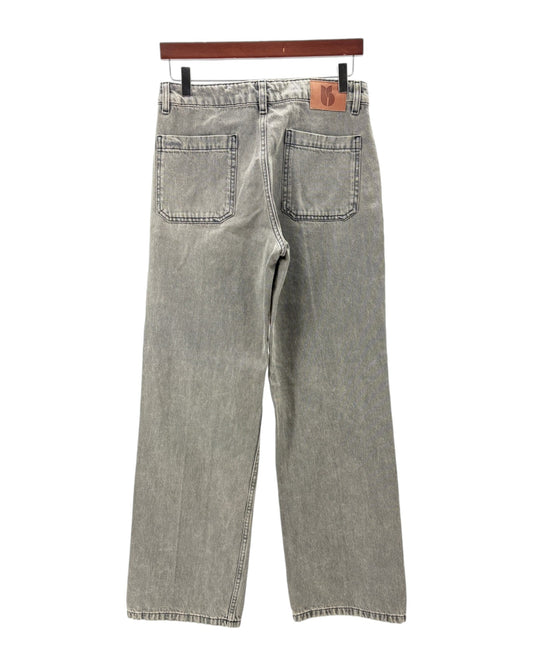 Gray jeans on a hanger against a white background