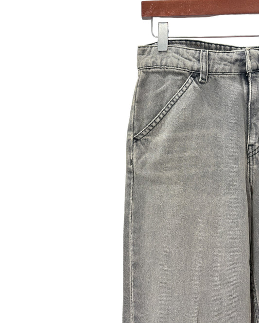 Gray jeans on a hanger against a white background