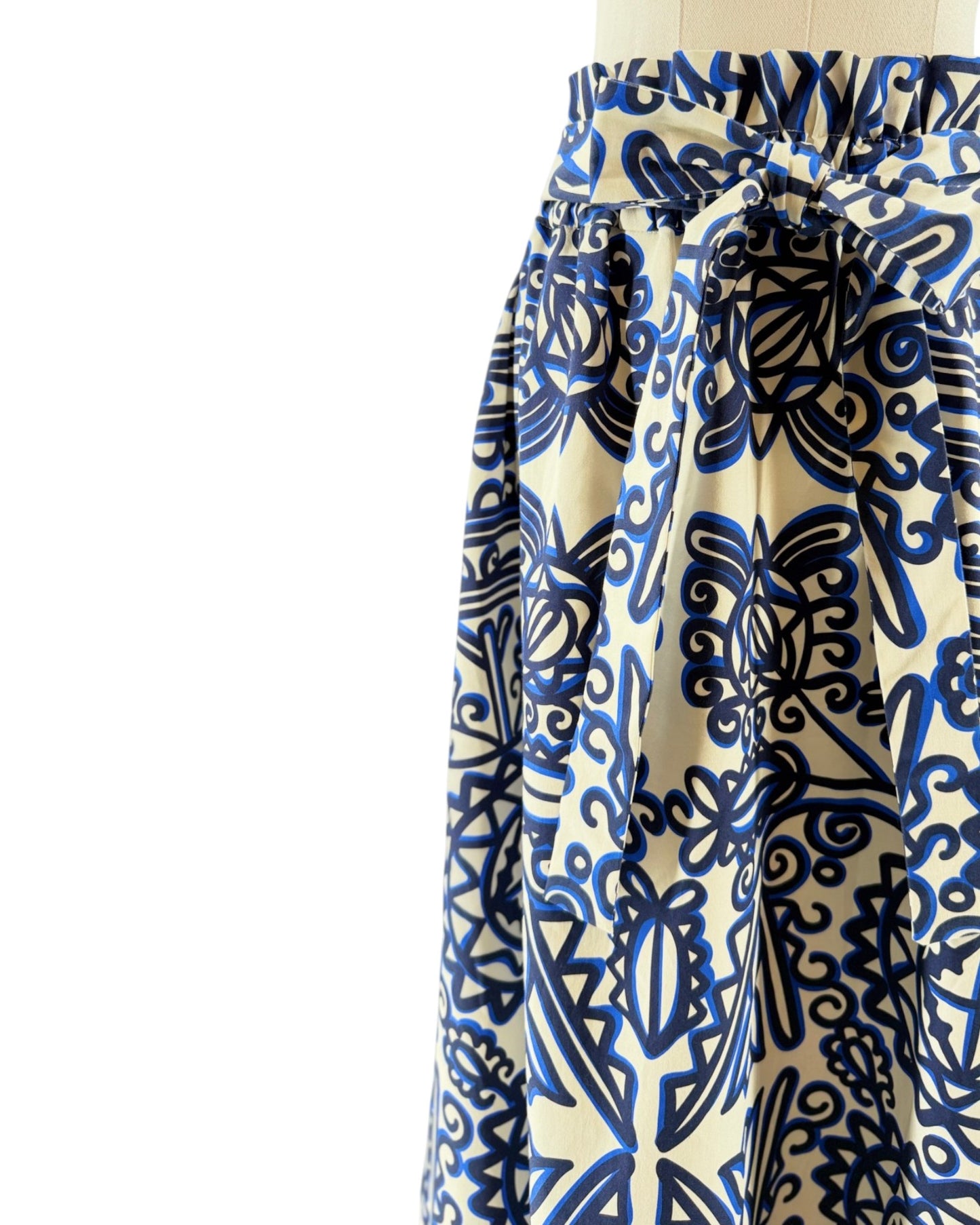Blue and white patterned skirt on a mannequin against a white background