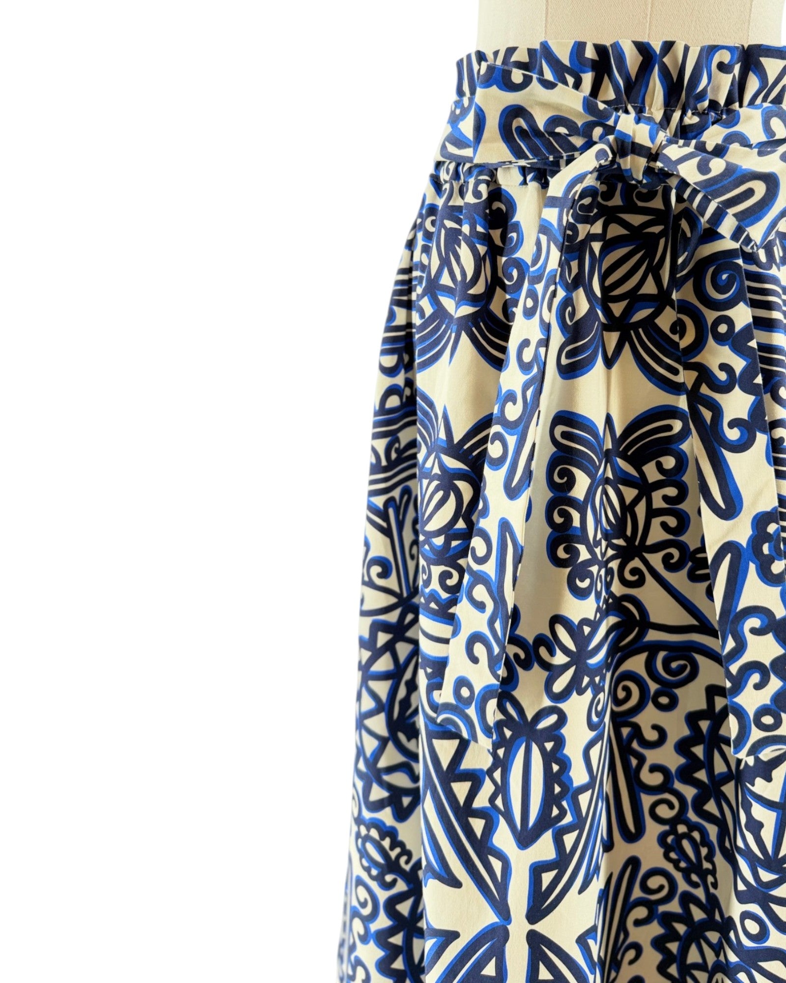 Blue and white patterned skirt on a mannequin against a white background