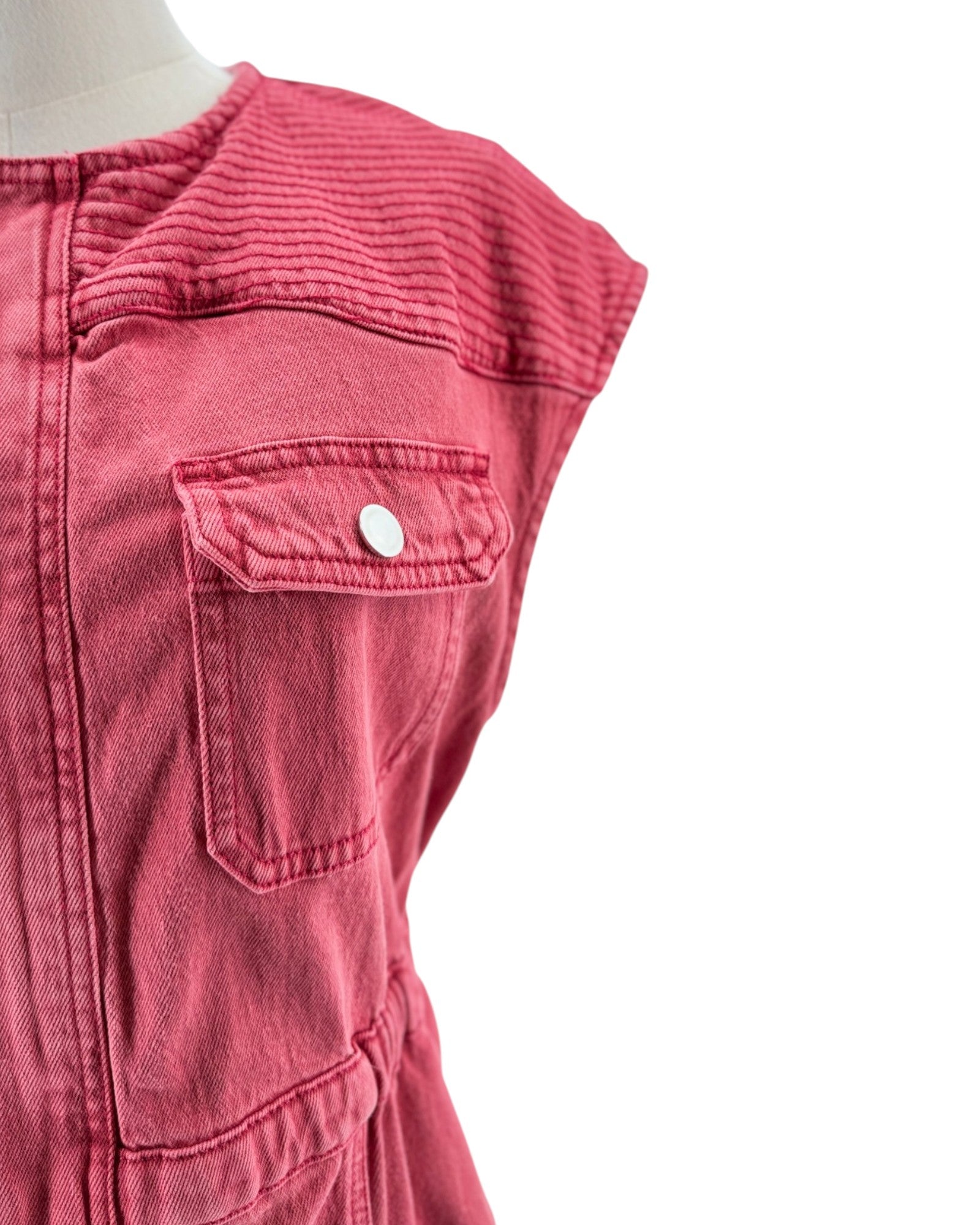 Close-up of a red sleeveless top with a pocket on a white background