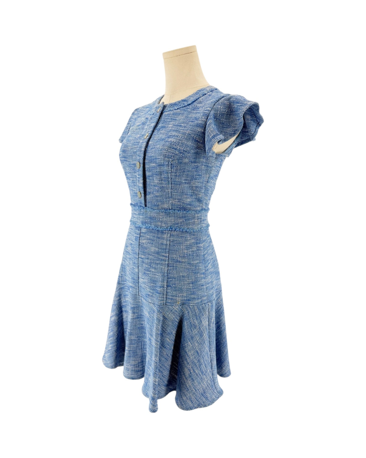 Blue Woven tweed, jewel neckline, partial button placket, playful flutter sleeves accented with with subtle fray trim, hidden back zipper with hook and eye mini dress on a mannequin on a white background
