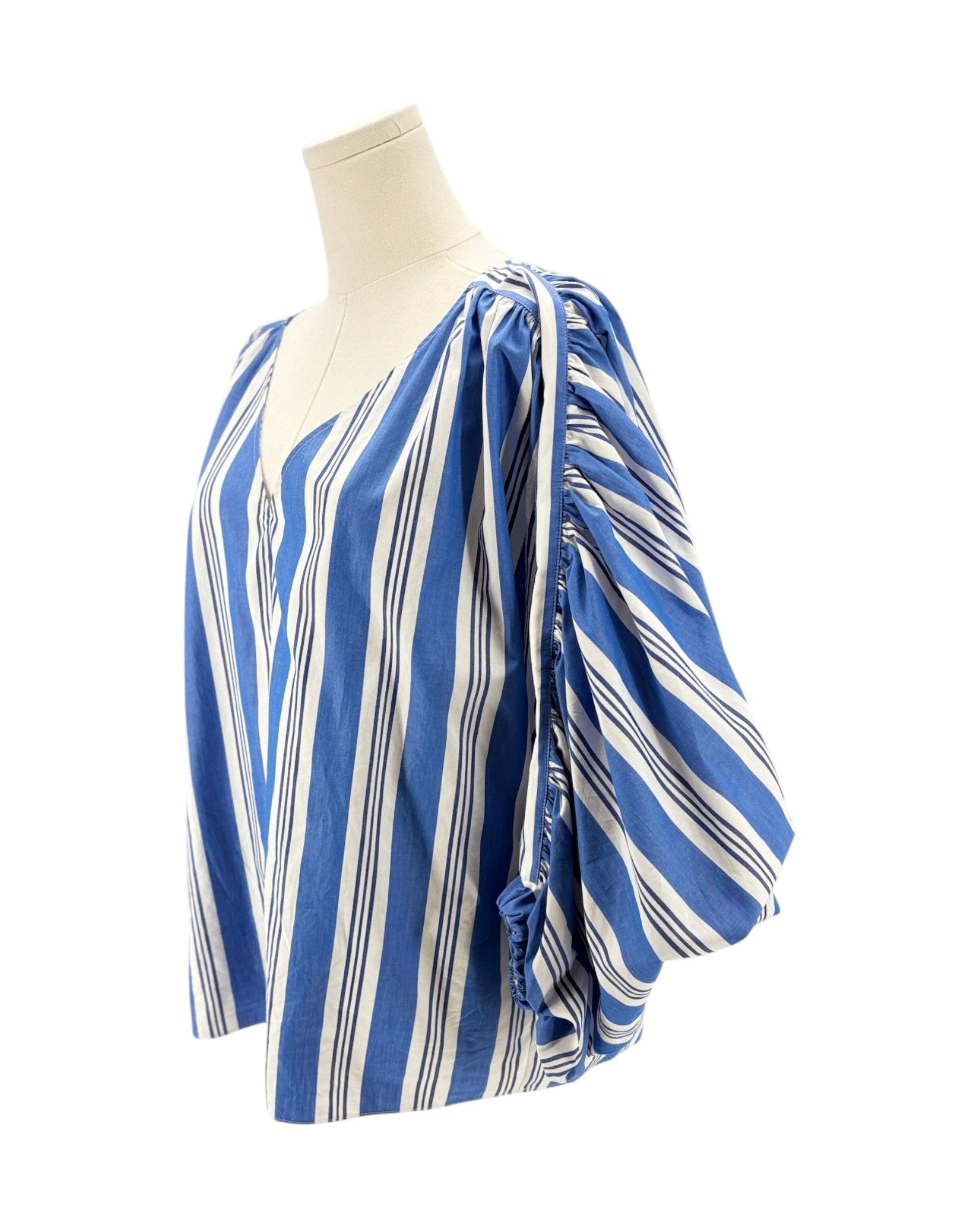 Blue and white striped top on a mannequin against a white background